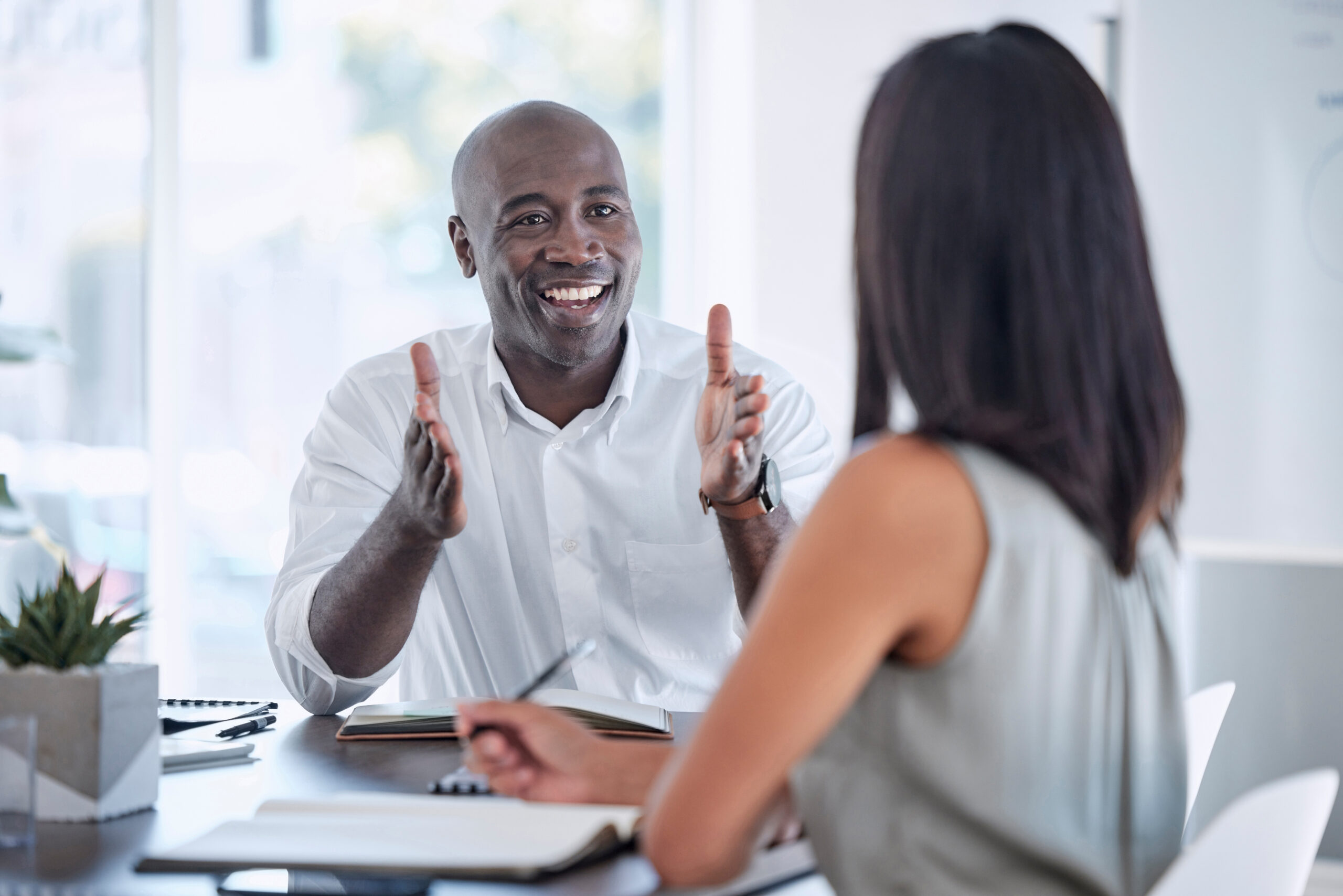 a man talking to a co-worker