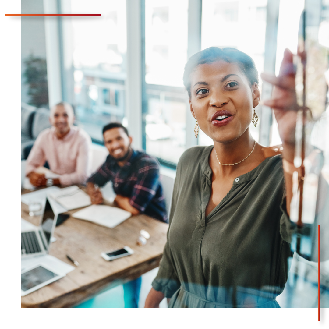 A business consultant speaking in a meeting