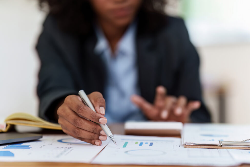 Accountant black woman working on laptop and do document, tax, exchange, accounting and Financial advisor concept